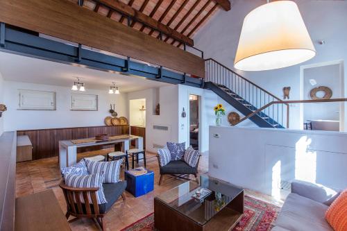 a living room with a couch and a table at Torre Fiore Hotel Masseria in Pisticci