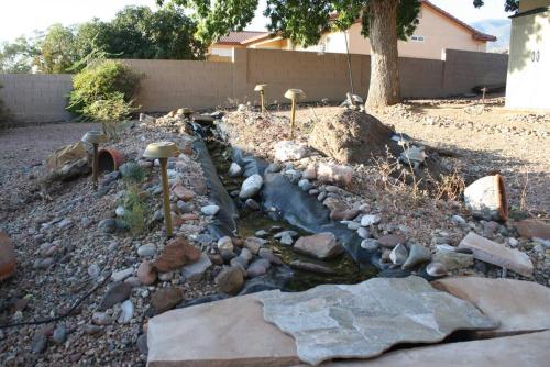 a garden with rocks and a stream of water at Quiet in Clarkdale in Clarkdale