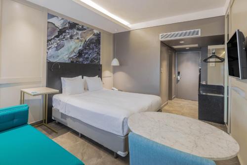 Postel nebo postele na pokoji v ubytování Hotel Deville Prime Cuiabá