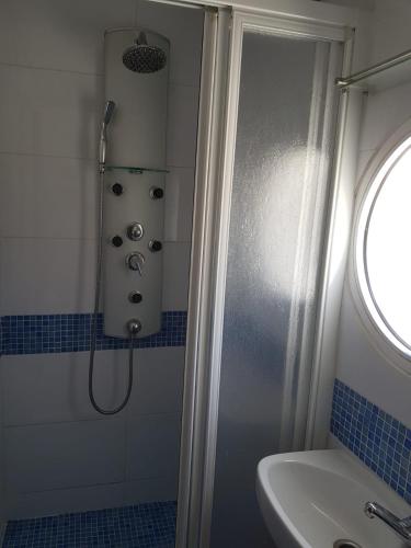 a bathroom with a shower and a sink at Finca Las Minas in Iznájar