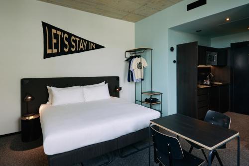 a hotel room with a bed and a desk at The Social Hub San Sebastián in Donostia-San Sebastián