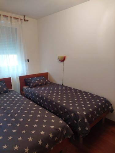 a bedroom with two beds in a room at Apartman Luka in Pula