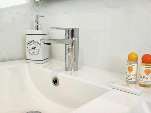 a sink with a faucet on a white counter at Vistas Mar Villas D by Stay ici in Albufeira