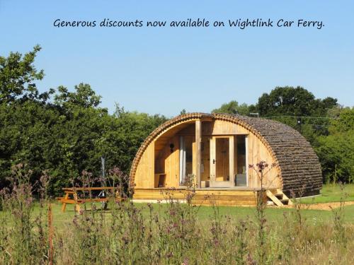 a small circular house with a round roof at Cosy Cabins at Westfield Farm, Isle of Wight in Yarmouth