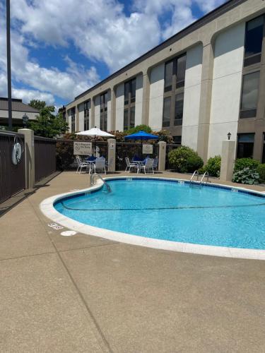 a swimming pool in front of a building at Hampton Inn New Bedford/Fairhaven in Fairhaven