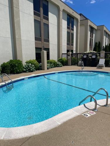 a large swimming pool in front of a building at Hampton Inn New Bedford/Fairhaven in Fairhaven