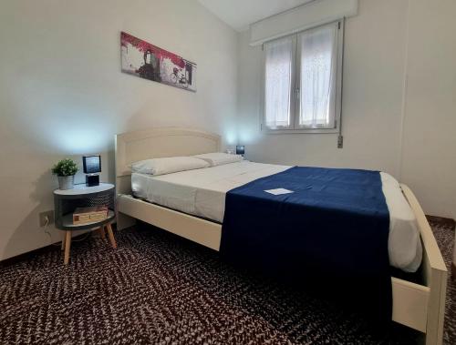 A bed or beds in a room at Nettuno 137D