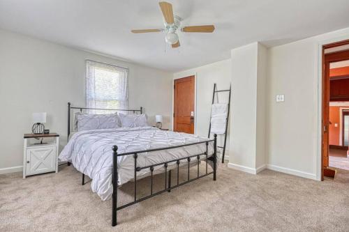 a bedroom with a bed and a ceiling fan at The Farm House in Dillsburg