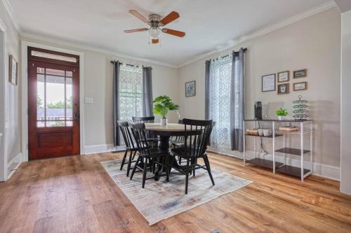 a dining room with a table and chairs and a ceiling fan at The Farm House in Dillsburg
