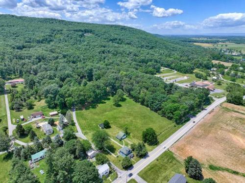 an aerial view of a park with houses and trees at The Farm House in Dillsburg