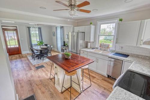 a kitchen with a table and a dining room at The Farm House in Dillsburg