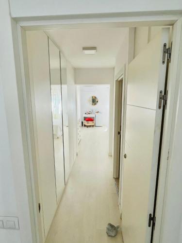 a hallway in a house with a mirror at Soleada,amplia con baño privado in Montequinto