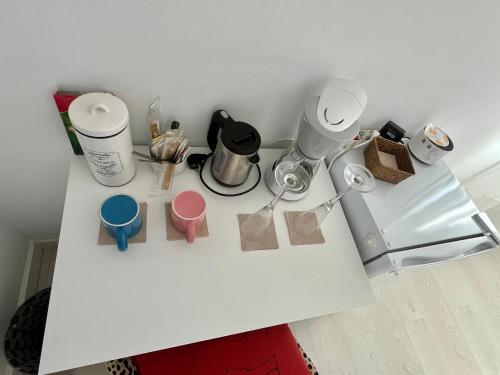 a white counter top with some items on it at Soleada,amplia con baño privado in Montequinto