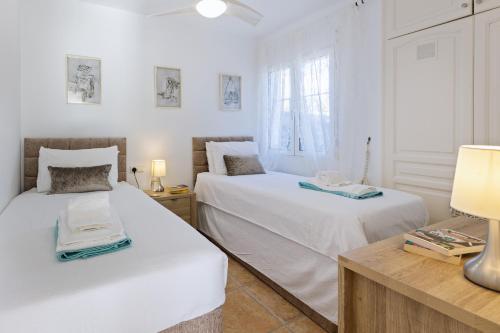 Ένα ή περισσότερα κρεβάτια σε δωμάτιο στο Casa Mitra