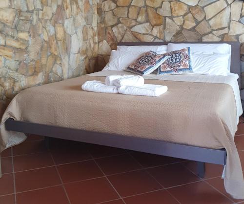 Postel nebo postele na pokoji v ubytování Casetta delle Mimose