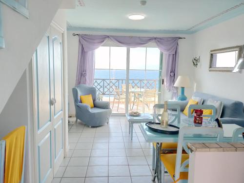 a living room with a view of the ocean at Rocas del Mar 408 in Costa Del Silencio