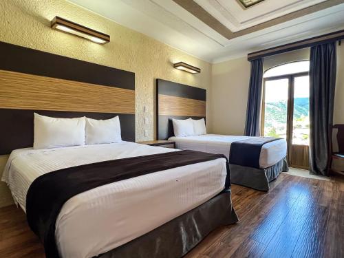 Katil atau katil-katil dalam bilik di Hotel Paseo de la Presa