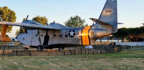 a military plane sitting on display in a field at Chambres Du Petit Bonheur in Biscarrosse