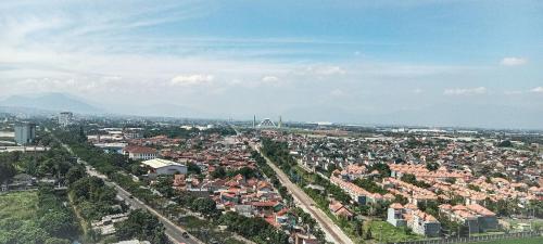 an aerial view of a city with buildings at Apartemen Panoramic by Dio Property in Bandung