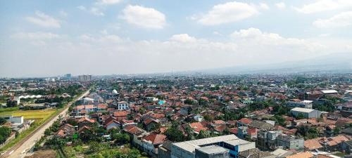 an aerial view of a city with buildings at Apartemen Panoramic by Dio Property in Bandung