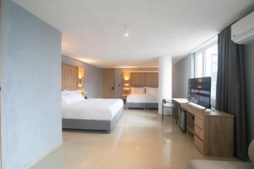Postel nebo postele na pokoji v ubytování Mood Matuna Hotel Cartagena
