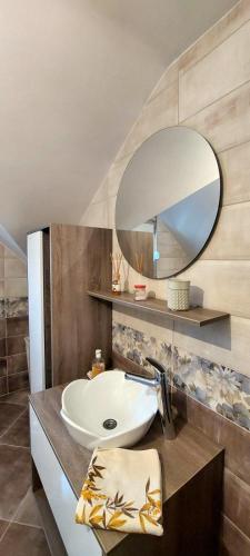 a bathroom with a sink and a mirror at Sunny in Trnava