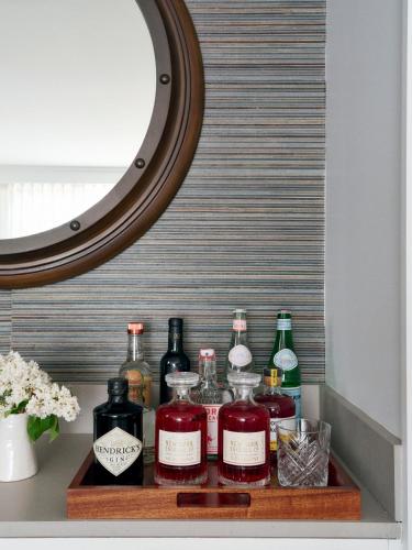 a shelf with several bottles of alcohol on it at Montauk Yacht Club in Montauk