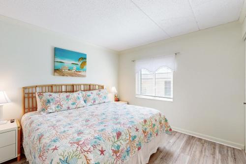 Ένα ή περισσότερα κρεβάτια σε δωμάτιο στο Waikiki Condos