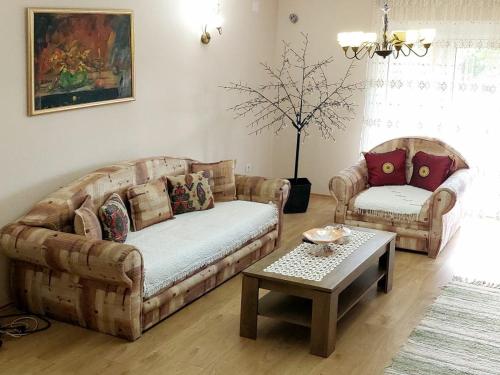 a living room with two couches and a coffee table at Sunny in Trnava