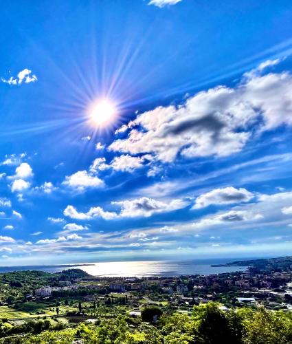 a blue sky with the sun in the sky at OleaVista in Portorož