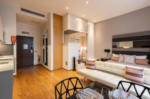 a living room with a couch and a bed at Space ApartHotel in London