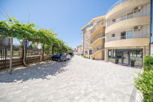a street with a car parked next to a building at Villa Dana in Bar