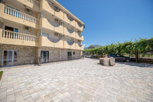 a parking lot in front of a building at Villa Dana in Bar