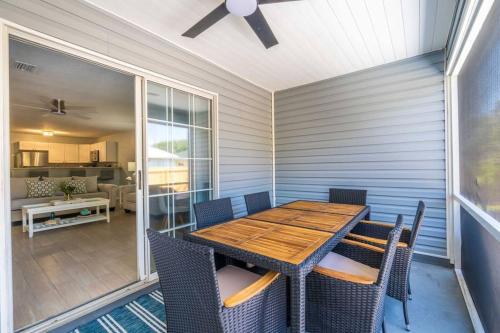 a dining room with a wooden table and chairs at Charming and delightful getaway! Walk to Beach in Saint Augustine