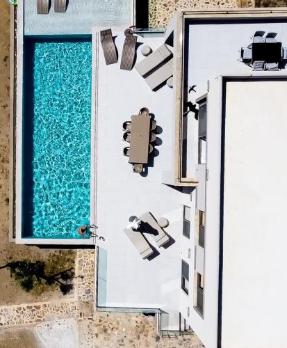 an overhead view of a house with a swimming pool at Presidential Beach Villa in Alyfantá