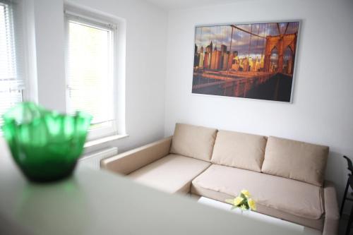 a living room with a couch and a table at White House Bochum Ehrenfeld in Bochum