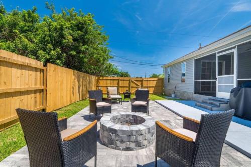 a backyard with chairs and a fire pit at Charming and delightful getaway! Walk to Beach in Saint Augustine