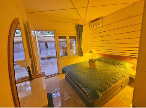 a bedroom with a bed in a yellow room at SUN SEA No 7 first line in Perea