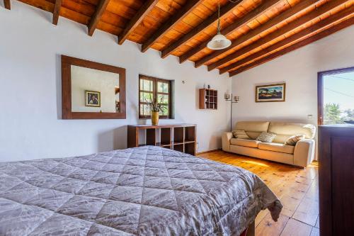 Postel nebo postele na pokoji v ubytování Finca El Capricho