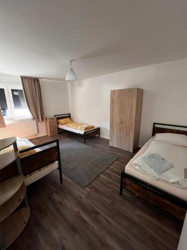 a room with two beds in a room at Wohnungen bei Post in Hünfelden