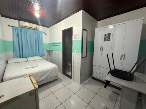 Ένα ή περισσότερα κρεβάτια σε δωμάτιο στο Hotel Maracá