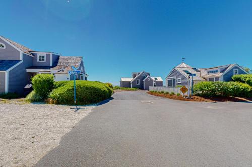 a row of houses on a street at Maushop By The Sea in Mashpee