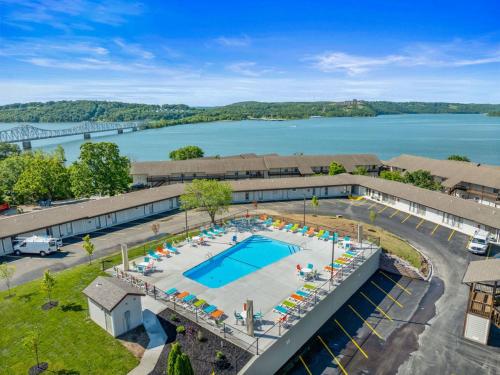 an aerial view of a resort with a swimming pool and a lake at Oasis on Table Rock Lake in Kimberling City