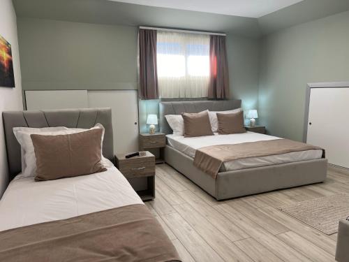 Postel nebo postele na pokoji v ubytování Coral Home