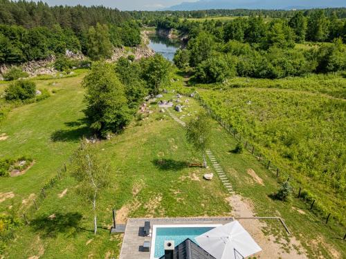 an aerial view of a farm with a swimming pool at River House Moon in Gospić