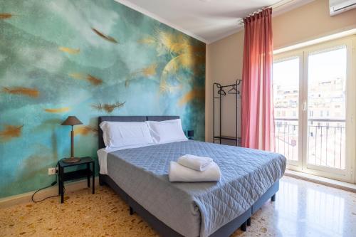 En eller flere senge i et værelse på Casa Preziosa in Metro Piramide