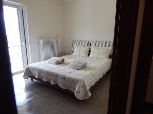 Ένα ή περισσότερα κρεβάτια σε δωμάτιο στο Samaras Apartments in Kamena Vourla