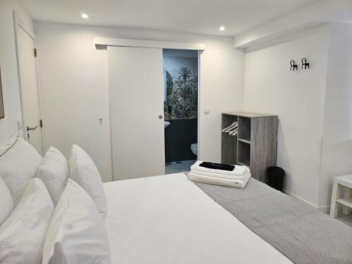 Ένα ή περισσότερα κρεβάτια σε δωμάτιο στο DoTejo Casa