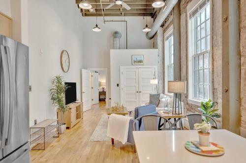 an apartment with white walls and a living room at Heart of Downtown Knoxville in Knoxville