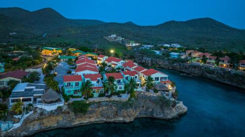 an aerial view of a resort on a rocky island in the water at Lagoon Ocean Resort in Lagun
